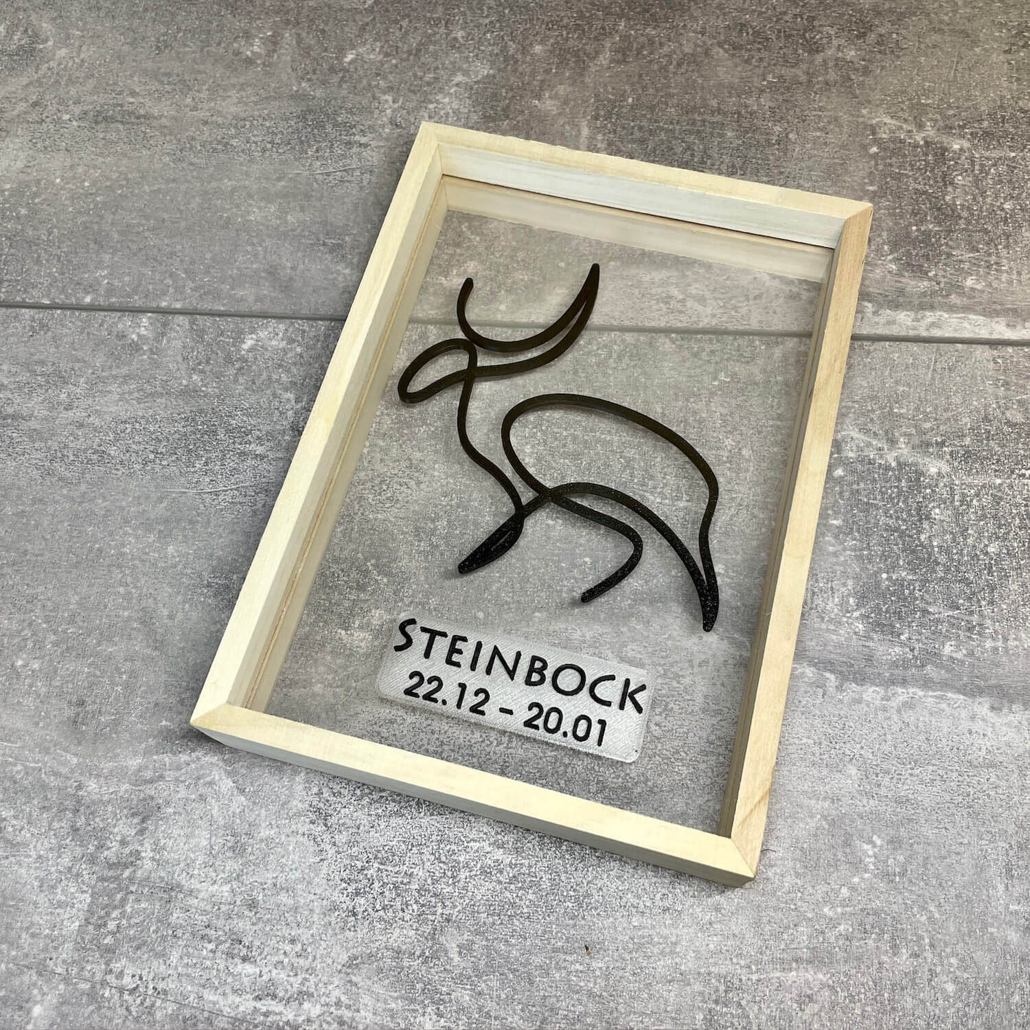 One Line Art Sternzeichen “Steinbock” im Schweberahmen